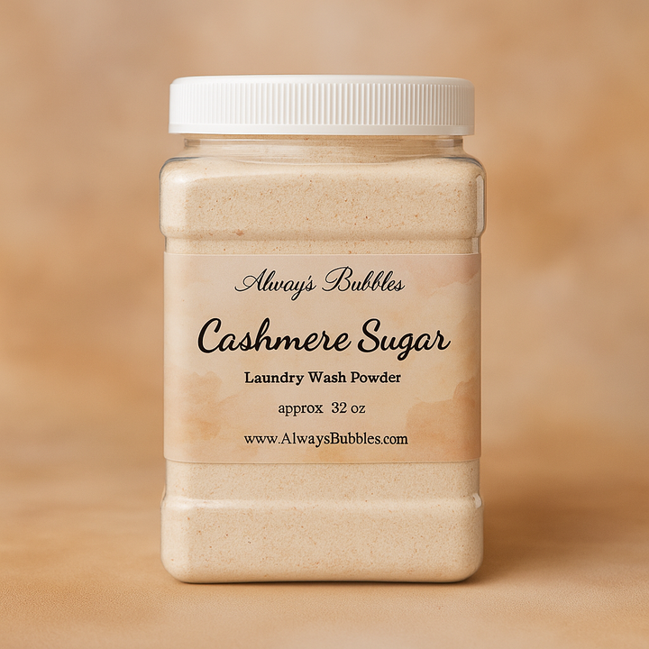 Always Bubbles Cashmere Sugar Laundry Wash Powder in a 32 oz jar with a warm, cozy beige background that reflects the soft cashmere-inspired scent.