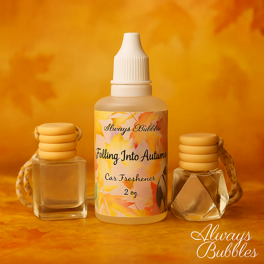 Always Bubbles Falling Into Autumn Car Freshener with cozy fall background featuring soft amber lighting and warm seasonal tones, displayed with refillable glass diffusers.
