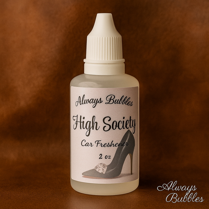 Always Bubbles High Society Car Freshener 2 oz bottle on a soft, elegant champagne-toned background, showcasing a luxurious scent blend of red currant, wild honey, and vanilla noir.
