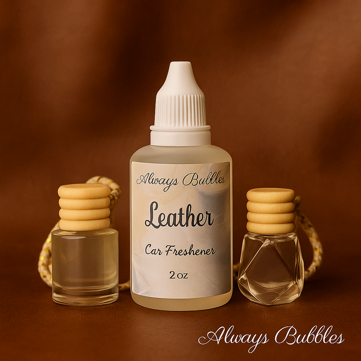 Always Bubbles Leather 2 oz Car Freshener with two glass diffusers on a soft brown leather-textured background, elegant and warm lighting. Logo at bottom right.