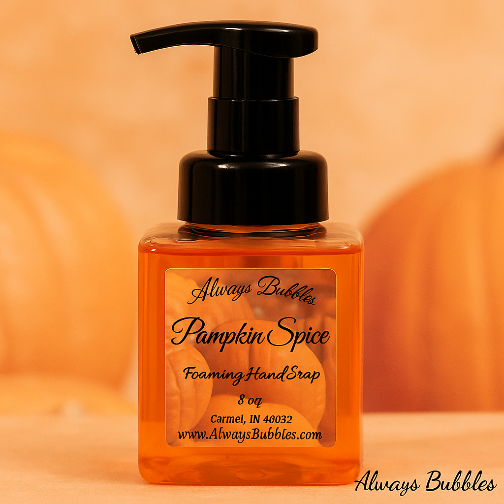 Always Bubbles Pumpkin Spice Foaming Hand Soap in a clear square bottle with black pump, filled with light orange soap, featuring a warm autumn pumpkin background.