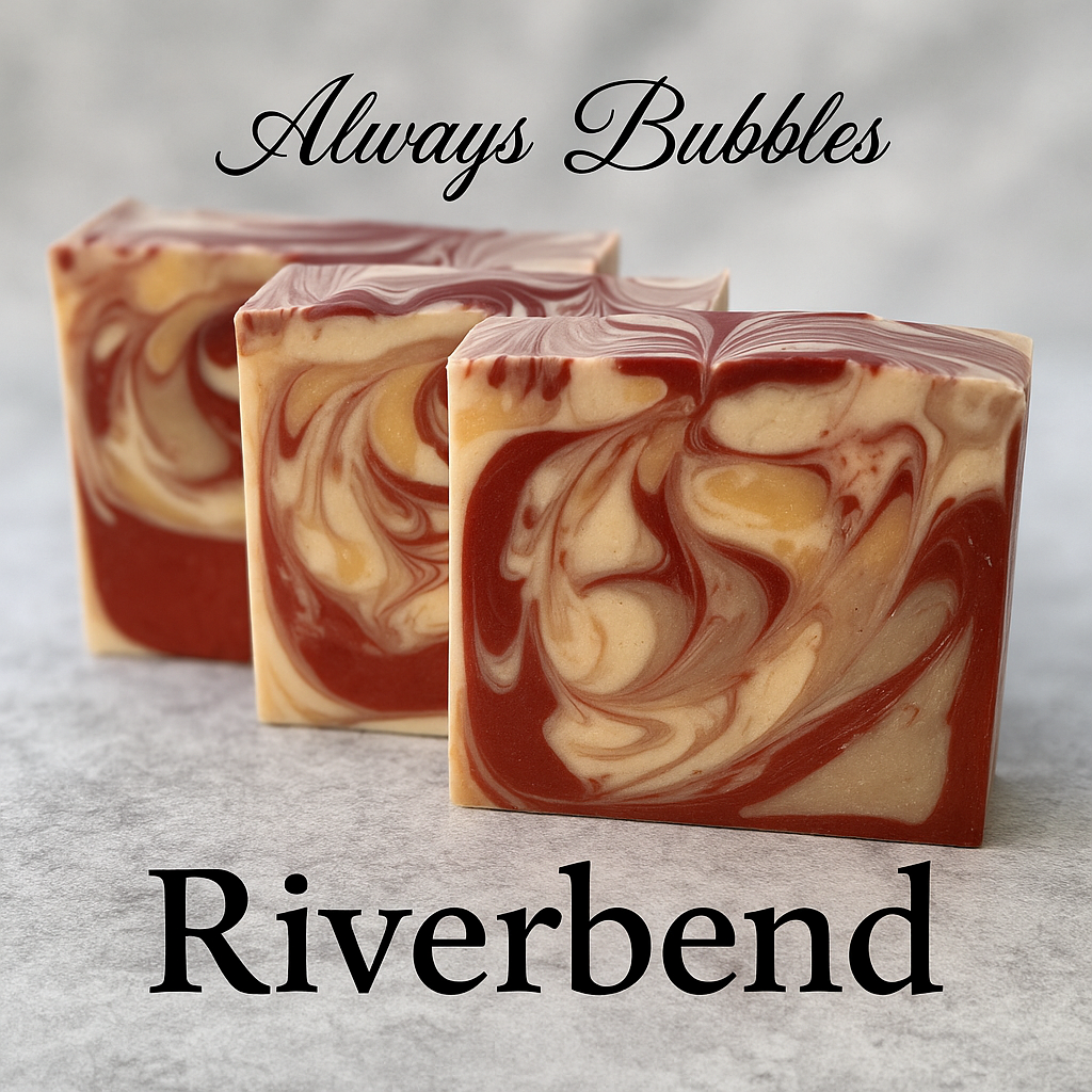 Riverbend artisan soap bars with rich burgundy and cream swirls displayed on a textured background