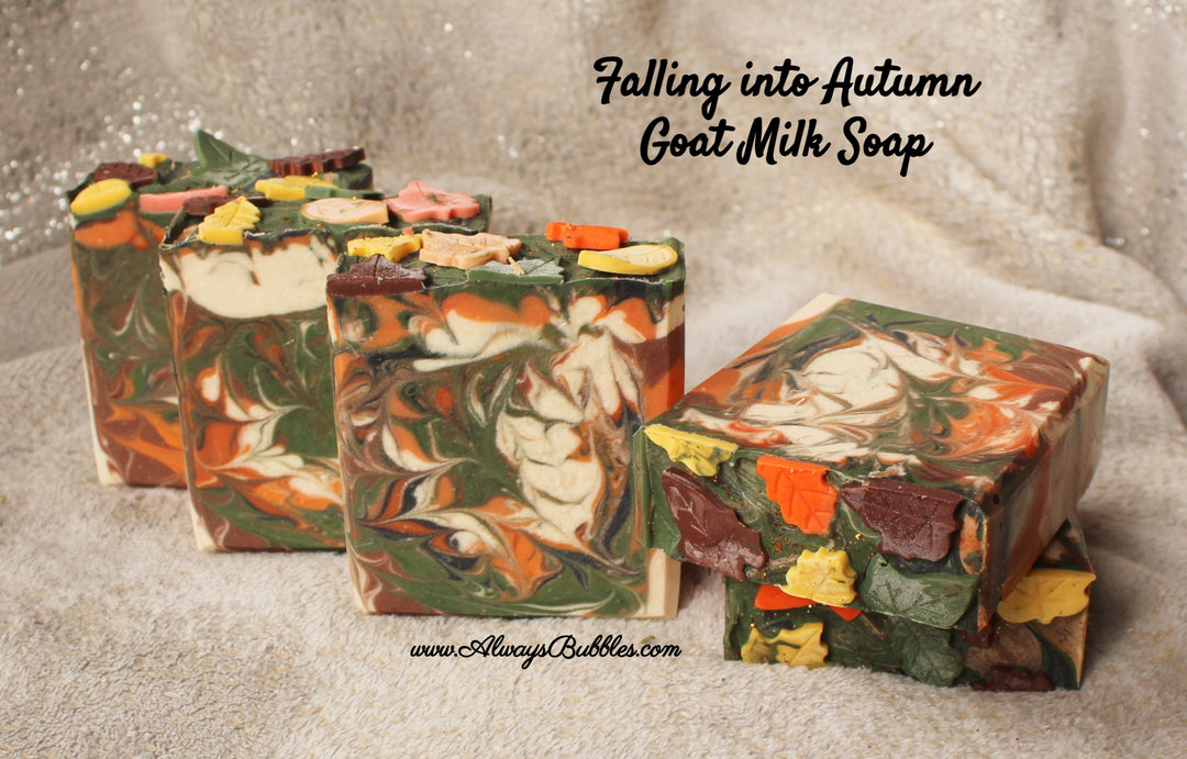 Falling into Autumn Goat Milk Soap by Always Bubbles — handmade bar soap with goat milk, shea butter, and natural oils. Swirled orange, green, cream, and brown colors with decorative fall leaf toppers. Cozy autumn fragrance for seasonal skincare.