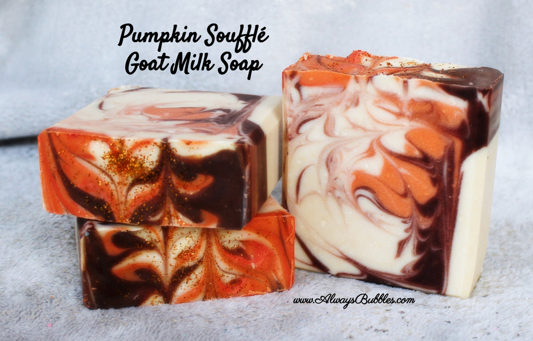 Pumpkin Soufflé Goat Milk Soap by Always Bubbles — handmade goat milk soap bar with rich swirls of orange, cream, and brown, dusted with golden shimmer. Cozy pumpkin dessert-inspired fragrance with nourishing shea butter and natural oils.